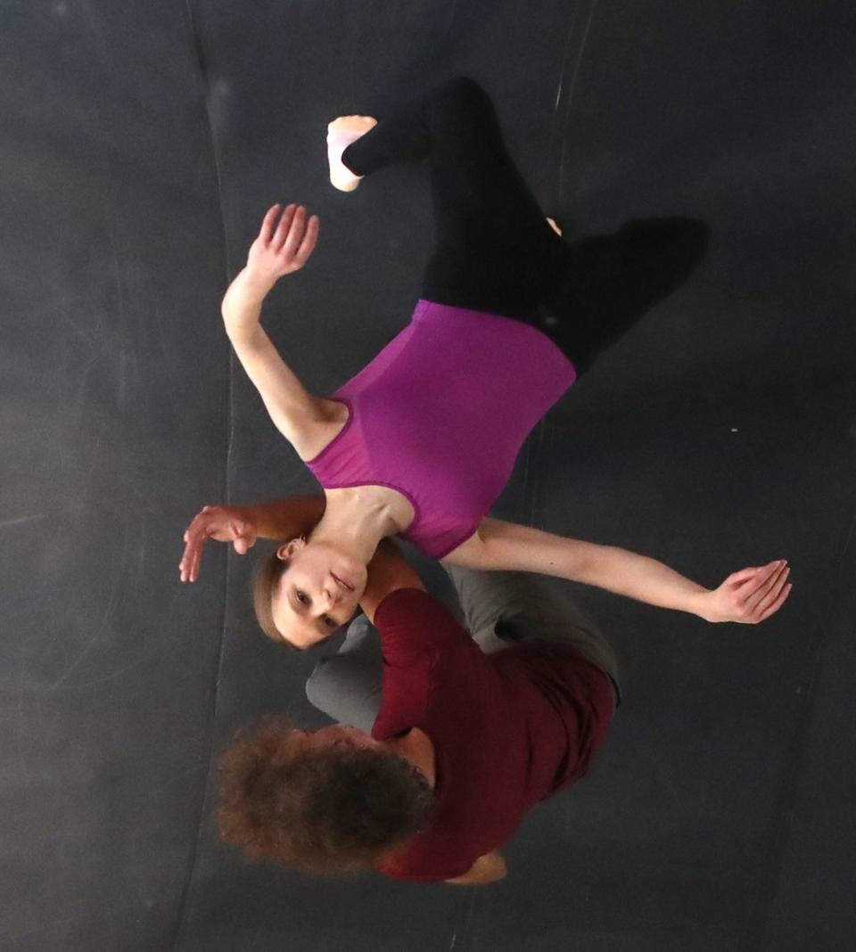 Dancers Lieneke Matte and Brian Murphy are reflected in a ceiling mirror as they rehearse in his home studio for the "Resilient Minds: Artistry after Injury" event the Brain Injury Association of Ohio is hosting on Friday in Akron.