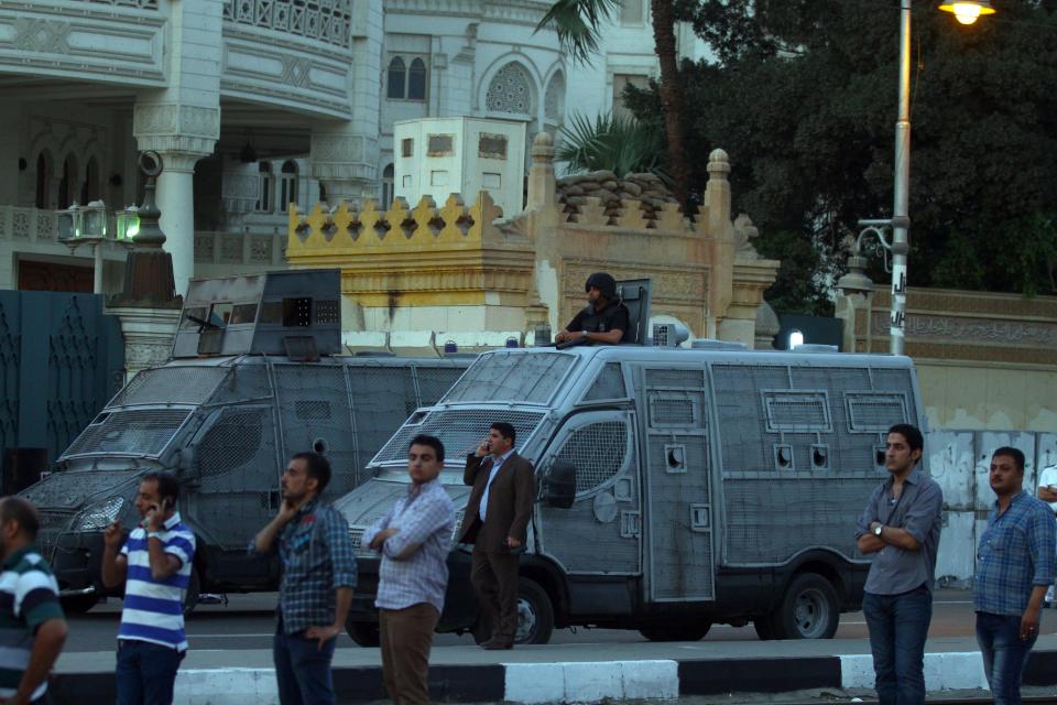 Police block the road in front of the presidential palace in Cairo, Egypt, Saturday, April 26, 2014. Hundreds of secular-minded activists and protesters rallied in front of the presidential palace Saturday, demanding the interim president abolish a disputed protest law used extensively over the past months to jail and prosecute activists, including leading figures of the 2011 uprising that toppled longtime autocrat Hosni Mubarak.