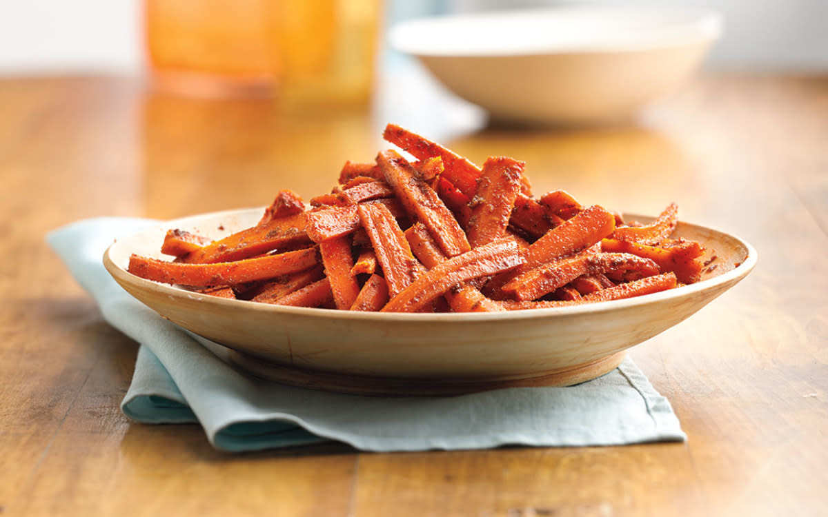 <p>Betty Crocker Cookbook</p><p>Roasting carrots in the oven is an easy way to bring out the natural sweetness of Easter’s most popular root vegetable. Get this <a href="https://parade.com/842209/communitytable/easy-carrot-side-dish-for-easter-dinner/" rel="nofollow noopener" target="_blank" data-ylk="slk:Cumin-Chili Roasted Carrots;elm:context_link;itc:0;sec:content-canvas" class="link rapid-noclick-resp">Cumin-Chili Roasted Carrots</a> recipe!</p><p><strong>Related: <a href="https://parade.com/1022051/parade/easter-recipes/" rel="nofollow noopener" target="_blank" data-ylk="slk:101 Best Easter Recipes;elm:context_link;itc:0;sec:content-canvas" class="link rapid-noclick-resp">101 Best Easter Recipes</a></strong></p>