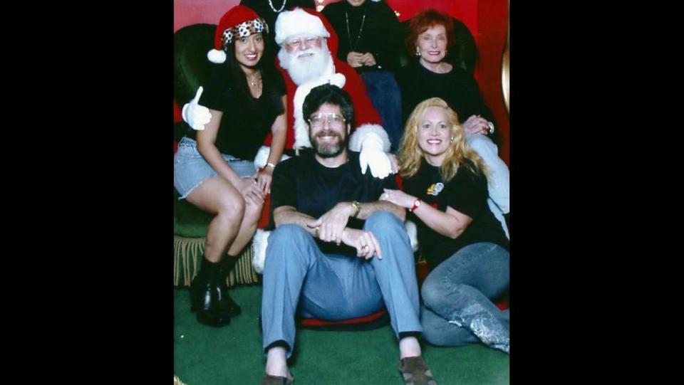 Novack family members pose with Santa Claus. From left: Stepdaughter May Abad, Ben Novack, wife Narcy Novack, mother Bernice Novack.