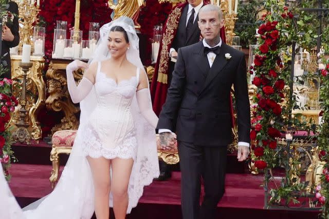 <p>Courtesy of Hulu</p> Kourtney Kardashian and Travis Barker at their Italian wedding