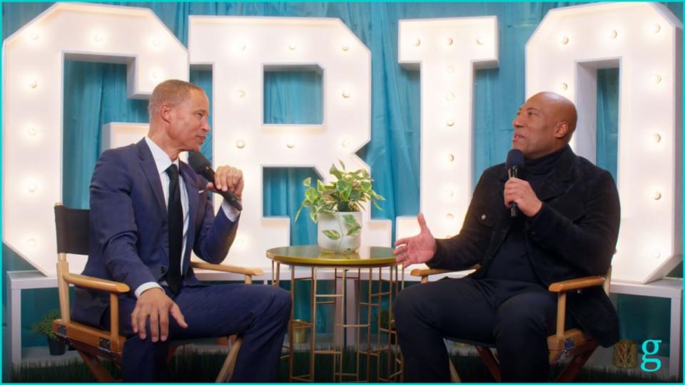 (Left to right) John Kelley listens as Byron Allen explains the need for a positive show centered around entertainment and variety. (credit: theGrio)