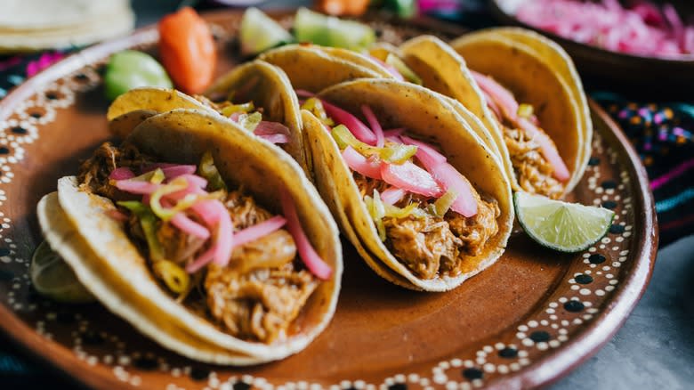 pork tacos with pickled onions