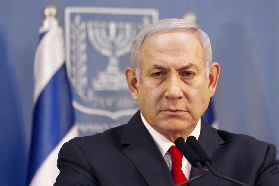 Israeli Prime Minister Benjamin Netanyahu delivers a statement in Tel Aviv, Israel, Sunday, Nov. 18, 2018. Netanyahu says he will take over temporarily as defense minister as early elections still loom. (AP Photo/Ariel Schalit)