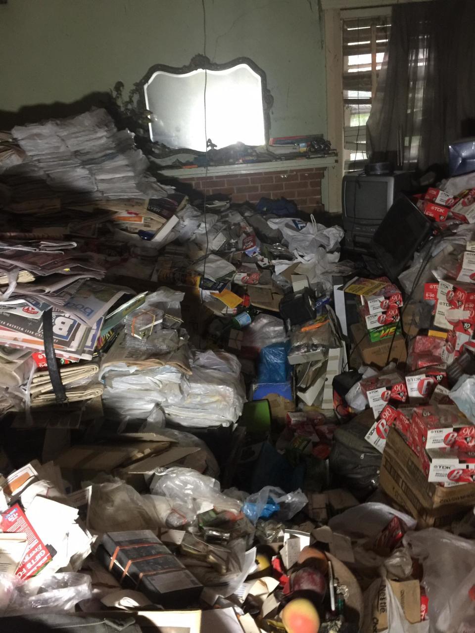 Piles of news papers are seen at a house on Greendale Street, Greenwich belonging to hoarder Bruce Roberts.