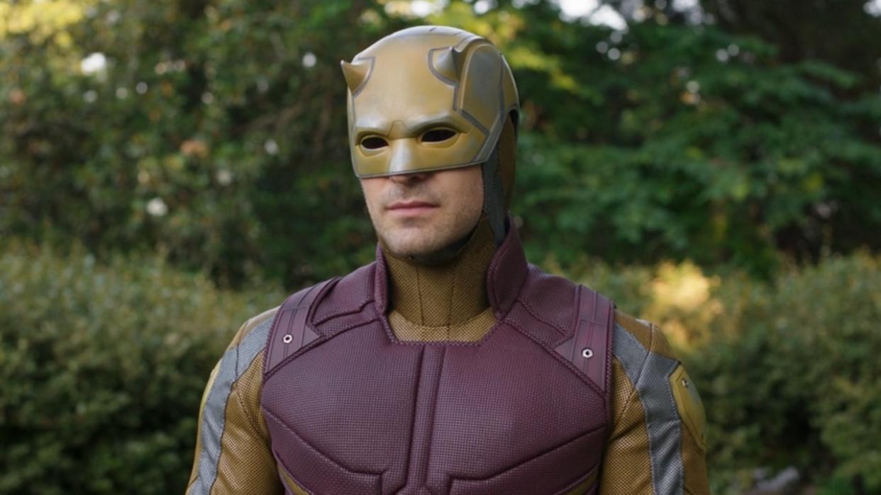  Charlie Cox wearing yellow and maroon Daredevil suit in She-Hulk: Attorney at Law. 