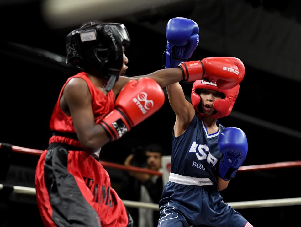 Jeremiah Lyons, left, and Woozy Wilson fight Saturday, March 5, 2022, at Main Street Boxing in Salisbury, Maryland.