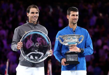 Tennis - Australian Open - Men's Singles Final - Melbourne Park, Melbourne, Australia, January 27, 2019. Serbia's Novak Djokovic and Spain's Rafael Nadal pose with their trophies. REUTERS/Lucy Nicholson