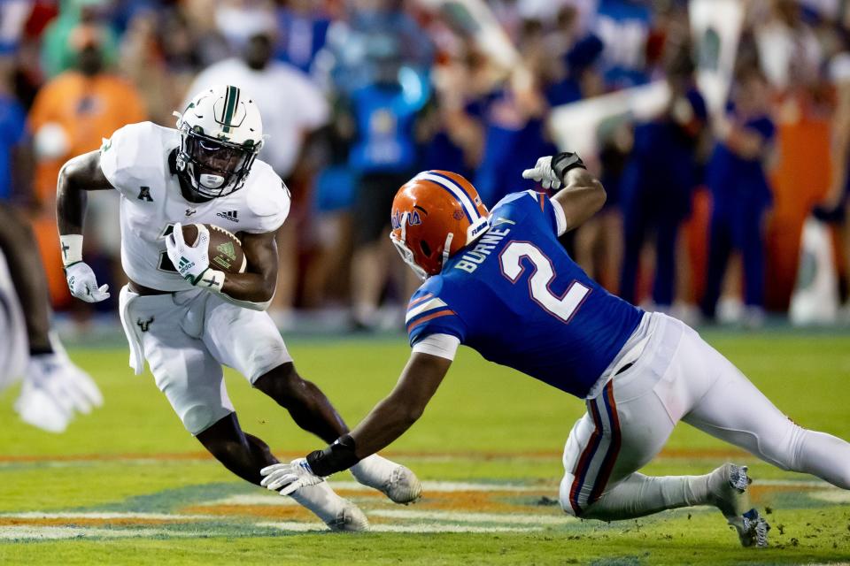 South Florida Bulls running back Jaren Mangham rushes with the ball during the second half against the Florida Gators in Gainesville, Florida on Saturday, Sept. 17, 2022.