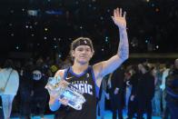 Osceola Magic's Mac McClung waves after winning the slam dunk competition at the NBA basketball All-Star weekend, Saturday, Feb. 17, 2024, in Indianapolis. (AP Photo/Darron Cummings)