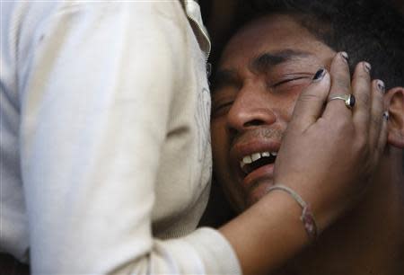 A family member of a victim of a bomb blast near a polling station during the Constituent Assembly Election, weeps outside the hospital in Kathmandu November 19, 2013. REUTERS/Navesh Chitrakar