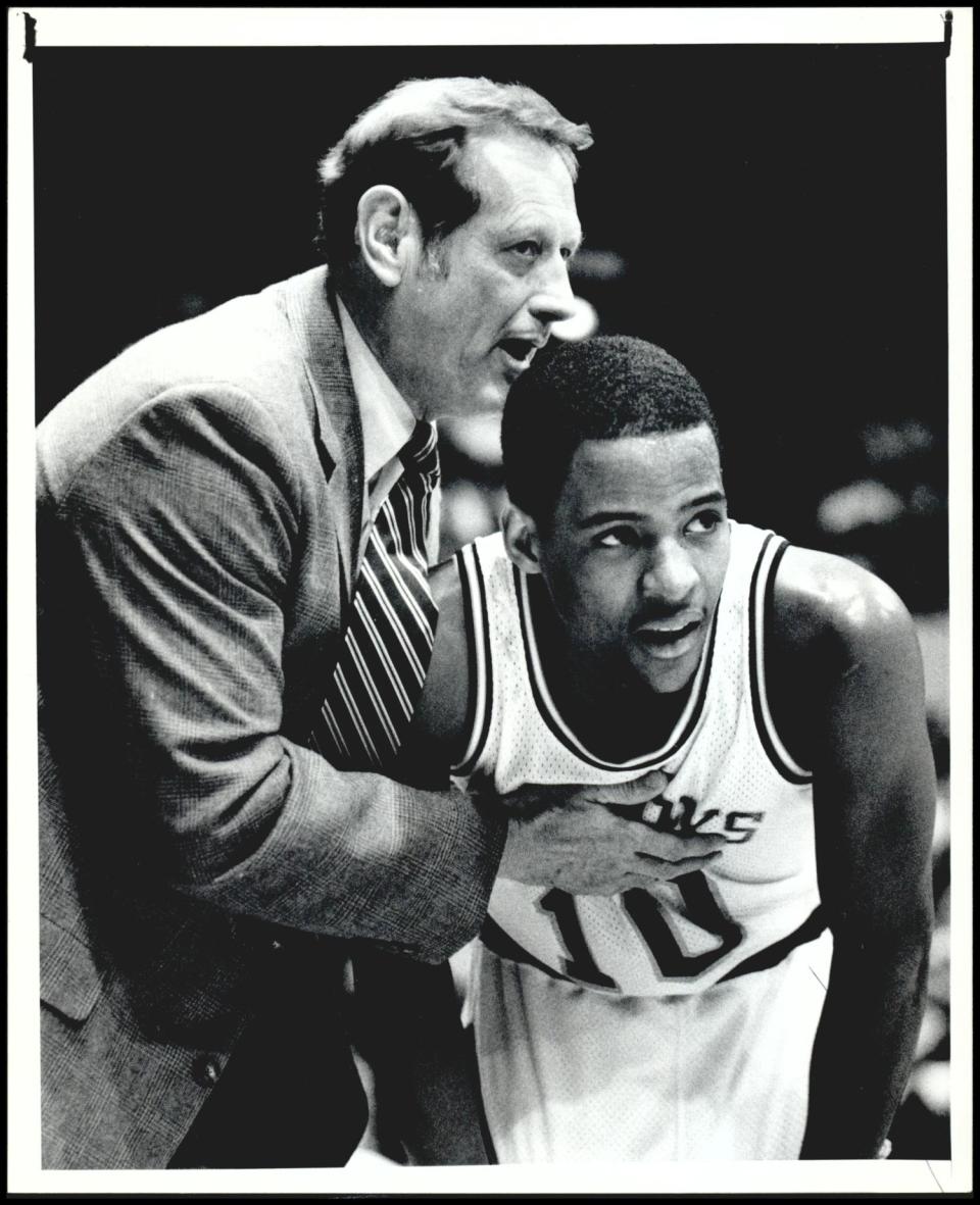 Then-OSU coach Paul Hansen has a quick strategy session with Win Case during a 1985 game against Iowa State.