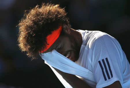 Tennis - Australian Open - Melbourne Park, Melbourne, Australia - 24/1/17 France's Jo-Wilfried Tsonga wipes his face during his Men's singles quarter-final match against Switzerland's Stan Wawrinka. REUTERS/Thomas Peter