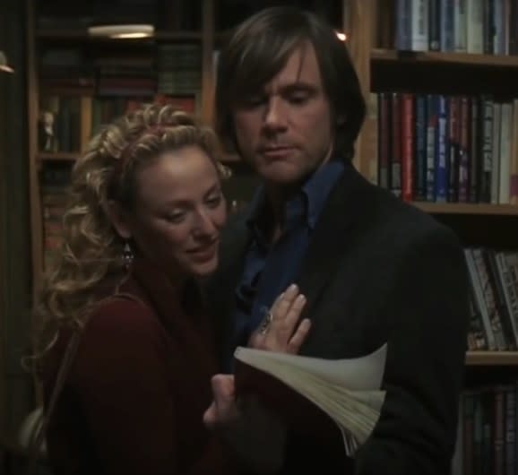 Jim Carrey  and Virginia Madsen as Walter and Agatha looking at a book together