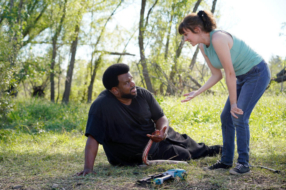 Claudia O'Doherty helps Craig Robinson, who has stapled a python to his hand