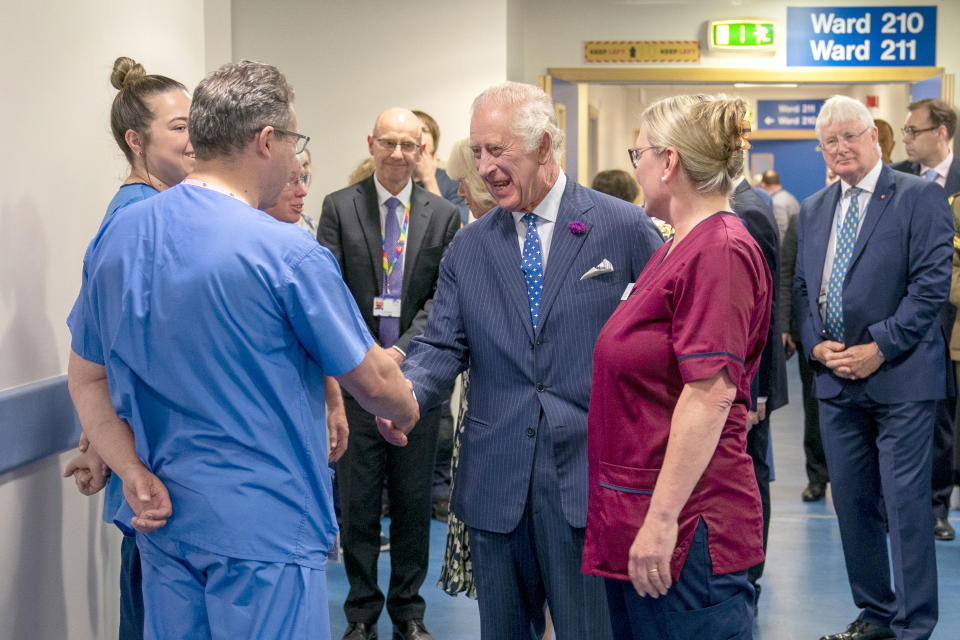 Britain's King Charles III, meets staff during their his visit to the Royal Infirmary of Edinburgh, to celebrate 75 years of the NHS at NHS Lothian, as part of the first Holyrood Week since his coronation, Scotland, Tuesday July 4, 2023. (Jane Barlow/Pool Photo via AP)