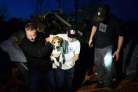 <p>A beagle named Charlie is rescued after being found under a pile of debris after a tornado touched down in Dunrobin, Ont., west of Ottawa, on Friday, Sept. 21, 2018. (Photo from Sean Kilpatrick/The Canadian Press) </p>