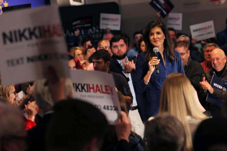 People cheer as Republican presidential candidate Nikki Haley speaks during a campaign event in the New Hampshire Institute of Politics at Saint Anselm College on February 17, 2023 in Manchester, New Hampshire.