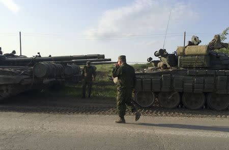 A picture shows a military convoy on the road side of the Russian southern town of Matveev Kurgan, May 26, 2015.REUTERS/Maria Tsvetkova