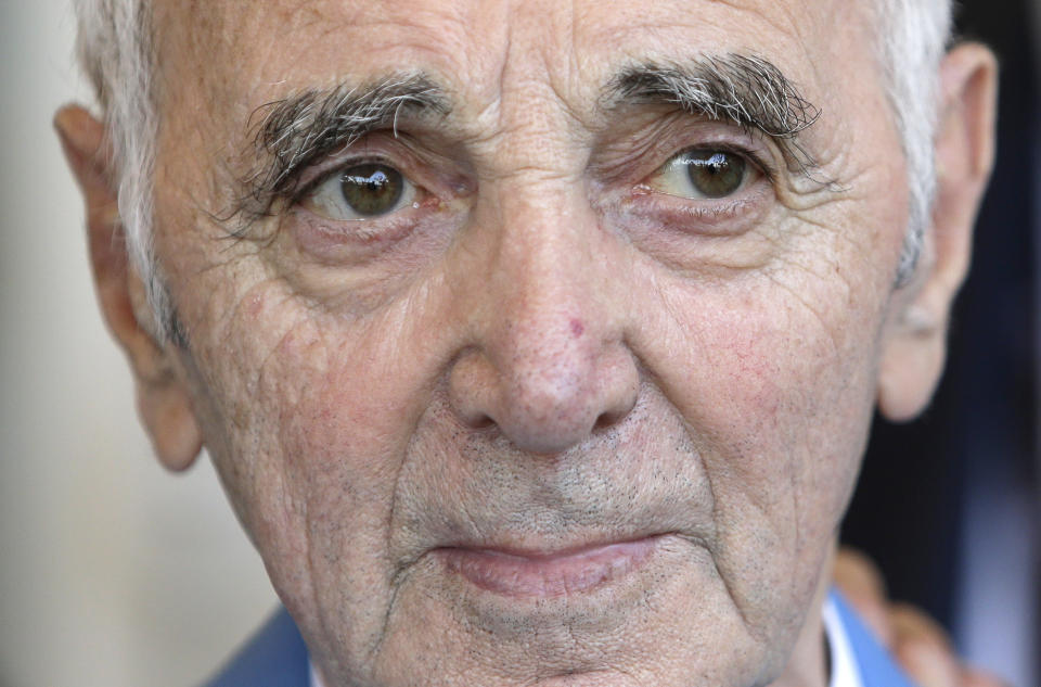 FILE - In this June 6, 2015 file photo, French and Armenian singer, songwriter and actor, Charles Aznavour poses in Cannes, southeastern France. Charles Aznavour, the French crooner and actor whose performing career spanned eight decades, has died. He was 94. (AP Photo/Lionel Cironneau, File)