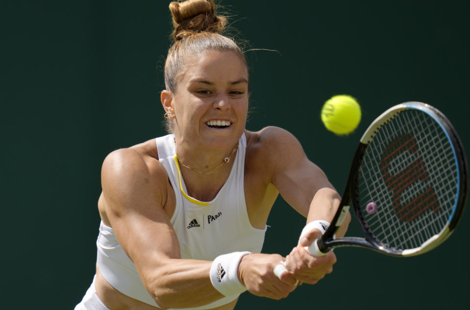 FILE - Greece's Maria Sakkari returns to Germany's Tatjana Maria during their women's third round singles match on day five of the Wimbledon tennis championships in London, Friday, July 1, 2022. Sakkari is expected to compete in the season-ending WTA Finals that begin Monday, Oct. 31, 2022, in Fort Worth, Texas. (AP Photo/Kirsty Wigglesworth, File)