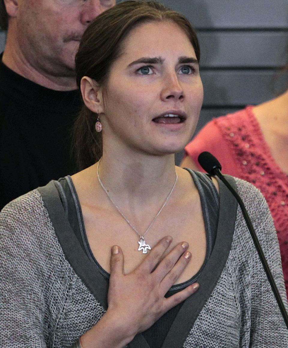 FILE - This Oct. 4, 2011 file photo shows Amanda Knox speaking at a news conference shortly after her arrival at Seattle-Tacoma International Airport in Seattle. To many Americans, especially in her hometown of Seattle, Amanda Knox seems the victim, unfairly hounded by a capricious foreign legal system for the death of a 21-year-old British woman. But in Italy and elsewhere in Europe, others see her as someone who got away with murder, embroiled in a case that continues to make global headlines and reinforces a negative image of Americans behaving badly, even criminally, abroad without any punishment. As she remains free in the U.S., these perceptions will not only fuel the debate about who killed Meredith Kercher in 2007 and what role, if any, Knox played in her death, but also about whether U.S. authorities should, if asked, send her to Italy to face prison (AP Photo/Elaine Thompson, file)