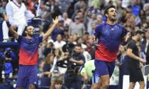 Robert Farah, right and Juan Sebastian Cabal, both of Colombia, react after defeating Marcel Granollers, of Spain, and Horacio Zeballos, of Argentina, in the men's doubles final of the U.S. Open tennis championships Friday, Sept. 6, 2019, in New York. (AP Photo/Sarah Stier)