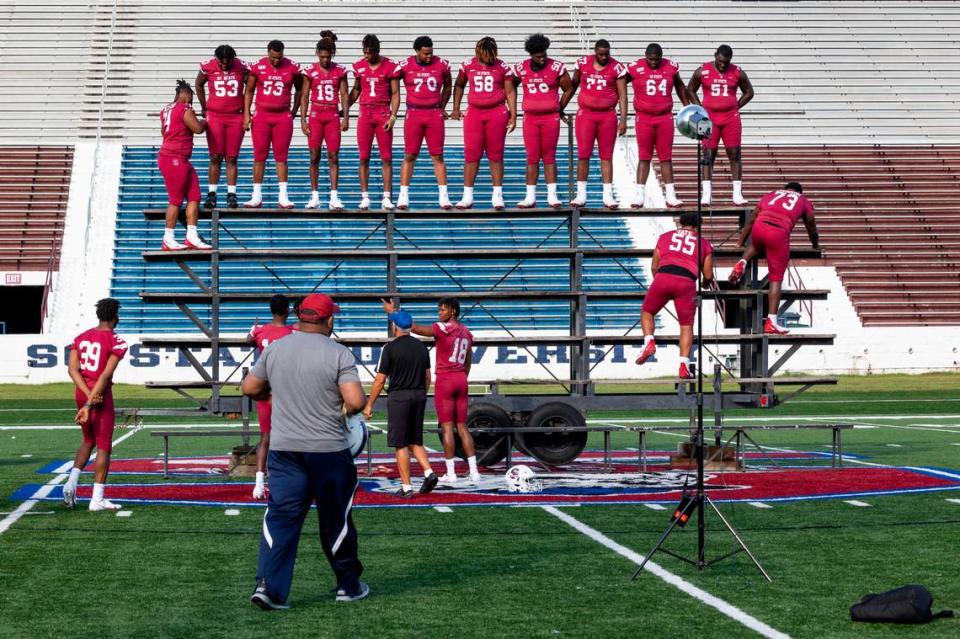 South Carolina State football players prepare for the team photo Aug. 13 at the Bulldogs’ on-campus media day. S.C. State’s expectations this season are as high as ever as after last season’s HBCU national championship win over Jackson State.