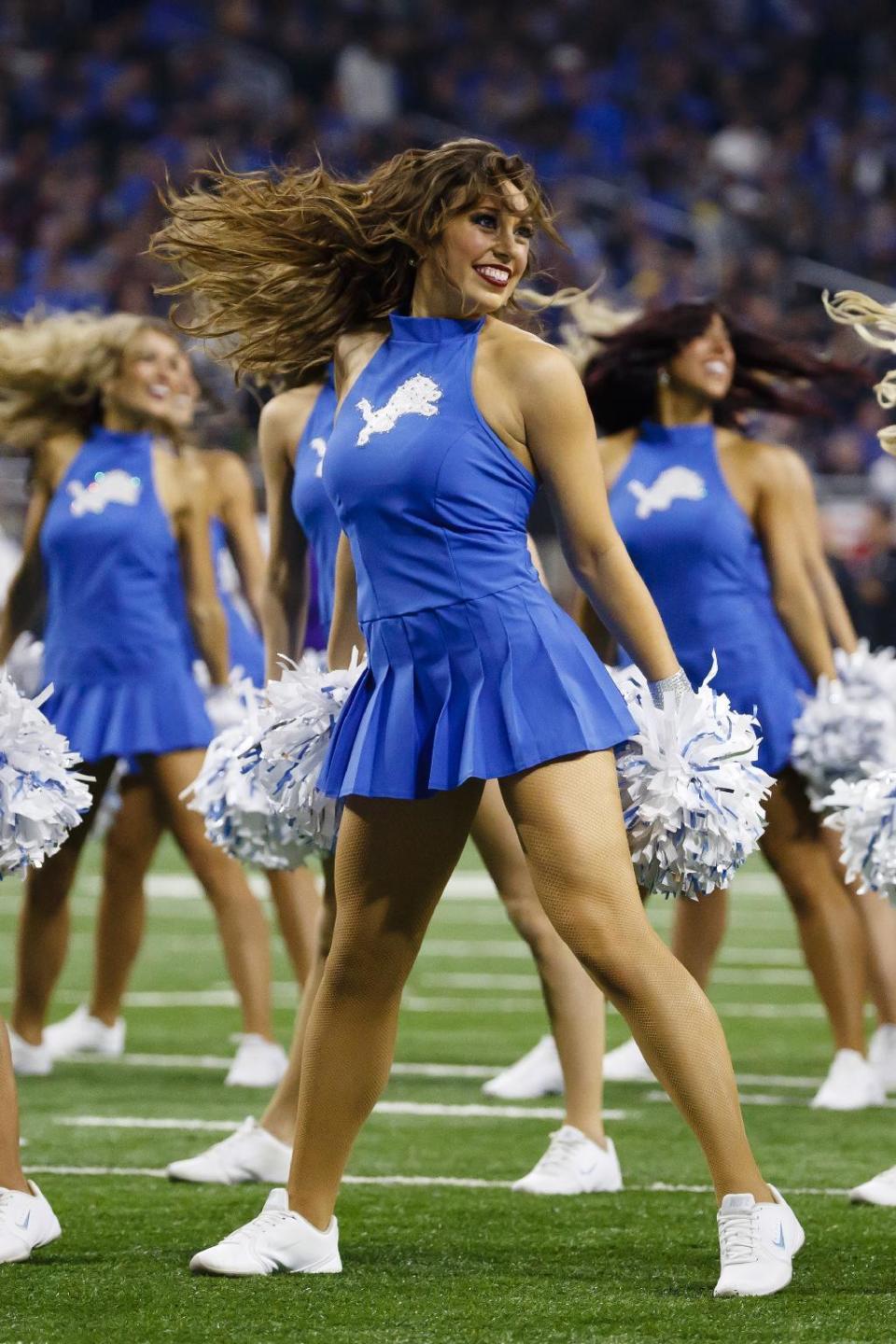 <p>Detroit Lions cheerleader performs against the Minnesota Vikings during an NFL football game, Thursday, Nov. 24, 2016 in Detroit. (AP Photo/Rick Osentoski) </p>