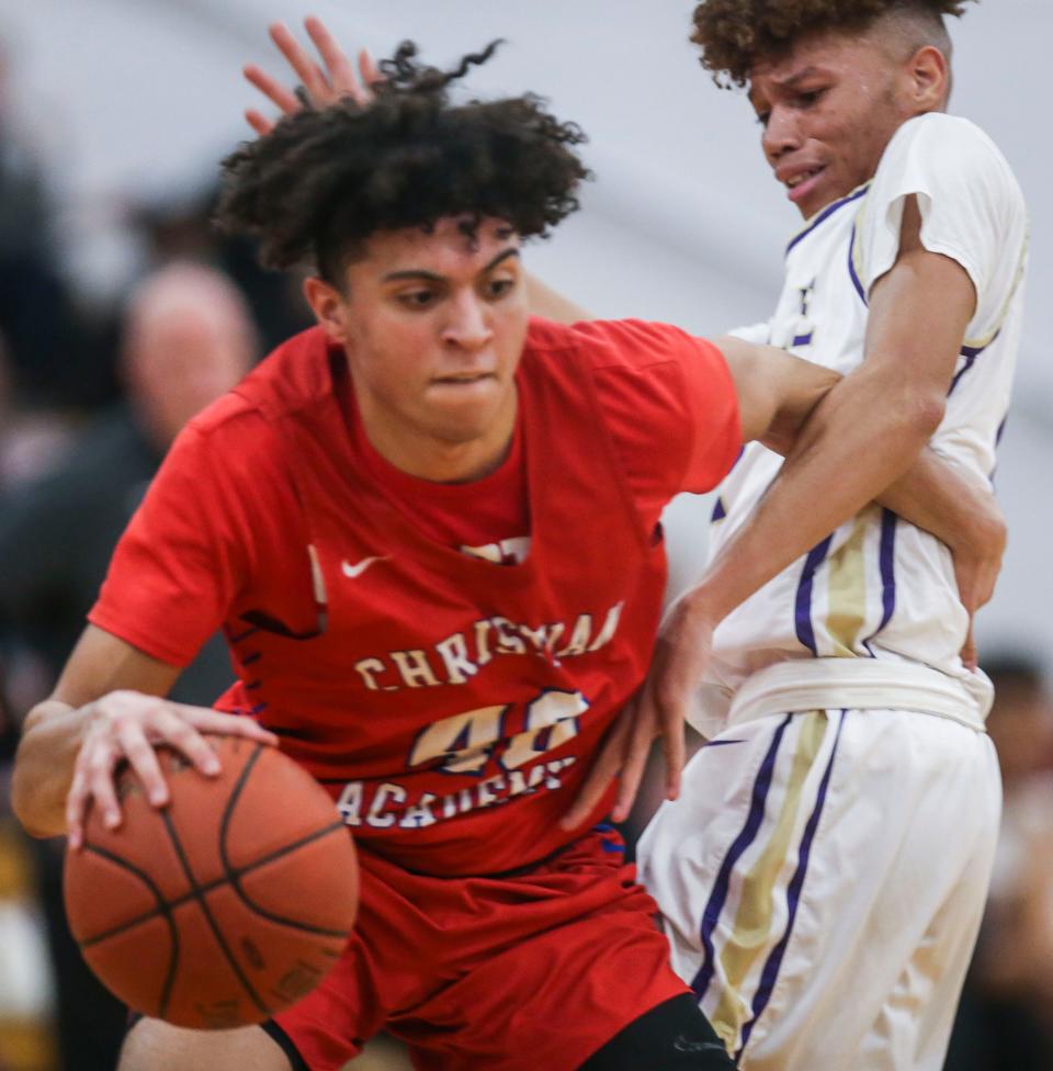 Male's Demetrius White tries to pressure Christian Academy's George Washington III. The Bulldogs outlast the Centurions 86-76 Tuesday night in the 7th Region boys quarterfinals. March 1, 2022