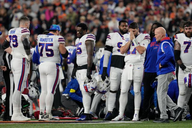 Bills, Bengals fans gather outside hospital to support Damar Hamlin: 'Least  we could do is come down and pray'