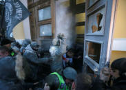 Supporters of former Georgian President and Ukrainian opposition figure Mikheil Saakashvili break into the building of the International Art Centre in Kiev, Ukraine, December 17, 2017. REUTERS/Valentyn Ogirenko