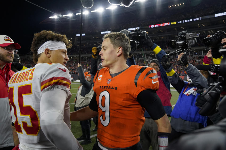 Cincinnati Bengals quarterback Joe Burrow (9) speaks with Kansas City Chiefs quarterback Patrick Mahomes (15) following an NFL football game, Sunday, Dec. 4, 2022, in Cincinnati. (AP Photo/Jeff Dean)