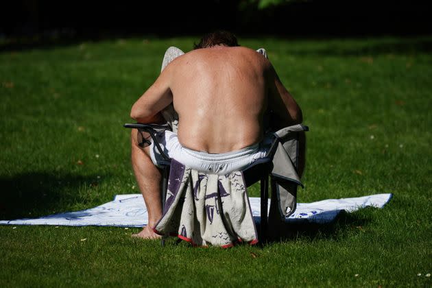 A man sunbathing in St James's Park, London on the hottest day of the year so far. (Photo: Yui Mok - PA Images via Getty Images)