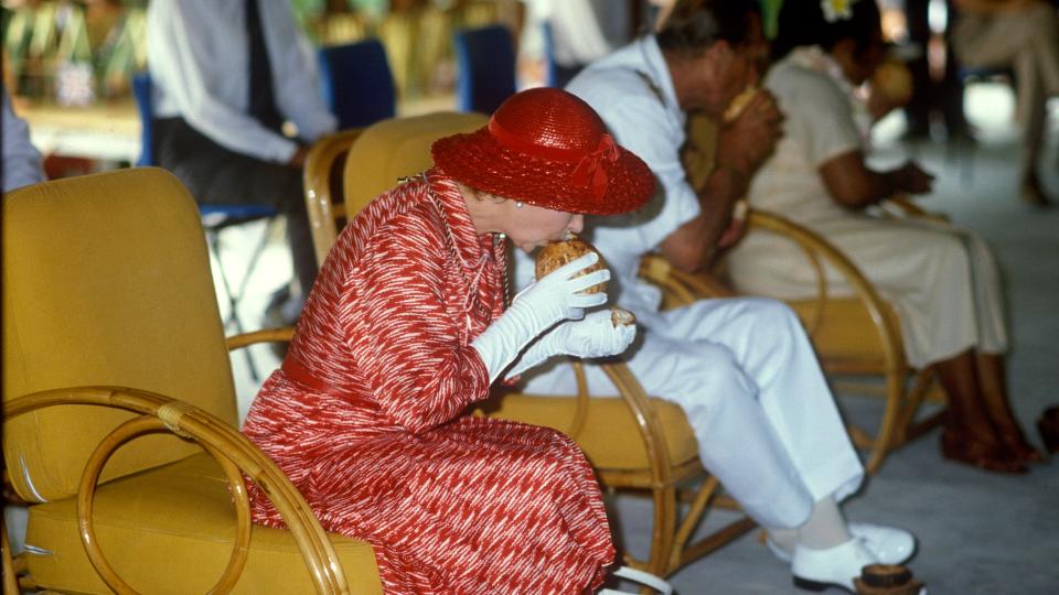 Queen Elizabeth II, Kiribati, Queen Elizabeth II drinks from a coconut, 23rd October 1982.