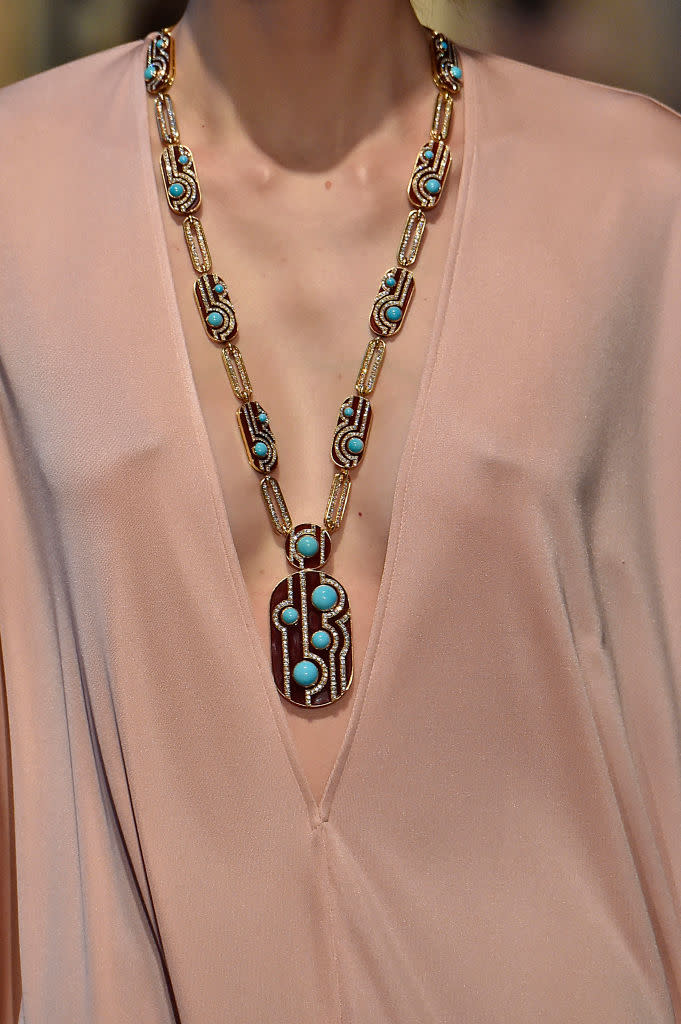 <p>Gold and turquoise pendant necklace at the Emilio Pucci FW18 show. (Photo: Getty Images) </p>