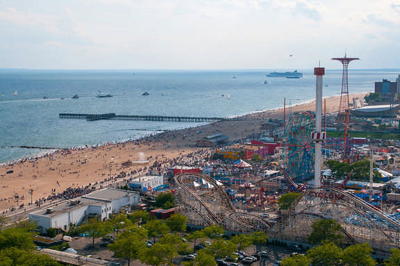 Space shuttle Enterprise, NASA’s original prototype orbiter, sails by Coney Island in Brooklyn, New York, on its way to Bayonne, NJ on June 3, 2012. The shuttle is ultimately destined for the Intrepid Sea, Air & Space Museum in New York City, w