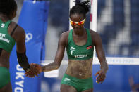 Gaudencia Makokha, right, of Kenya, celebrates a play with teammate Brackcides Khadambi, during a women's beach volleyball match against the United States at the 2020 Summer Olympics, Thursday, July 29, 2021, in Tokyo, Japan. (AP Photo/Petros Giannakouris)