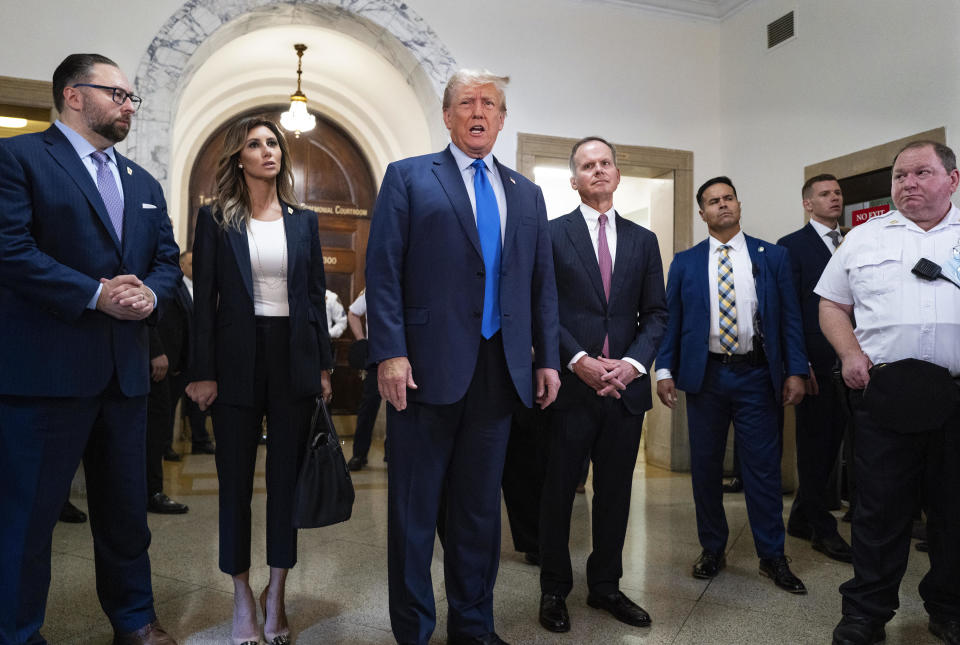 Former President Donald Trump speaks with journalists before entering a courtroom in New York on Monday, Oct. 2, 2023, to attend the start of his civil fraud trial. / Credit: Craig Ruttle / AP