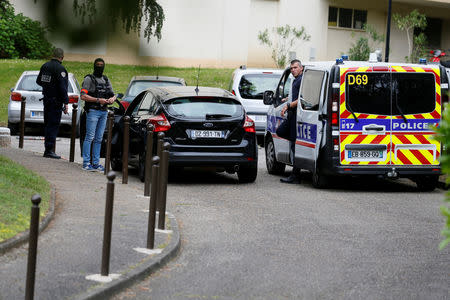 Investigators are seen during a police operation in Oullins, France, May 27, 2019. REUTERS/Emmanuel Foudrot