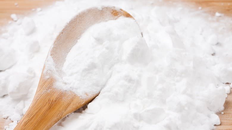 Baking soda with a wooden spoon