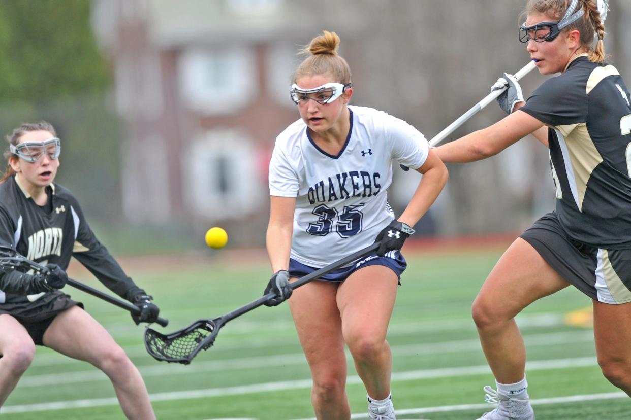 Moses Brown's Charley Lagor keeps her eye on the ball in the Quakers' D-I opener against North Kingstown.