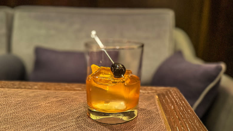 old fashioned cocktail on table