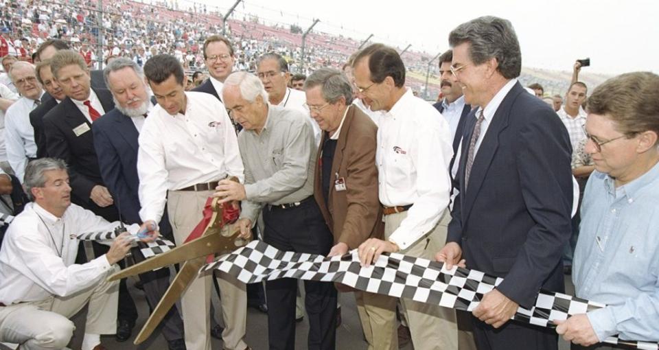 roger penske and a group break ground at auto club