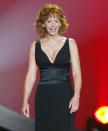 <p>Reba's ACMs look in 2004 consisted of a plunging black neckline that couldn’t go unnoticed.</p>