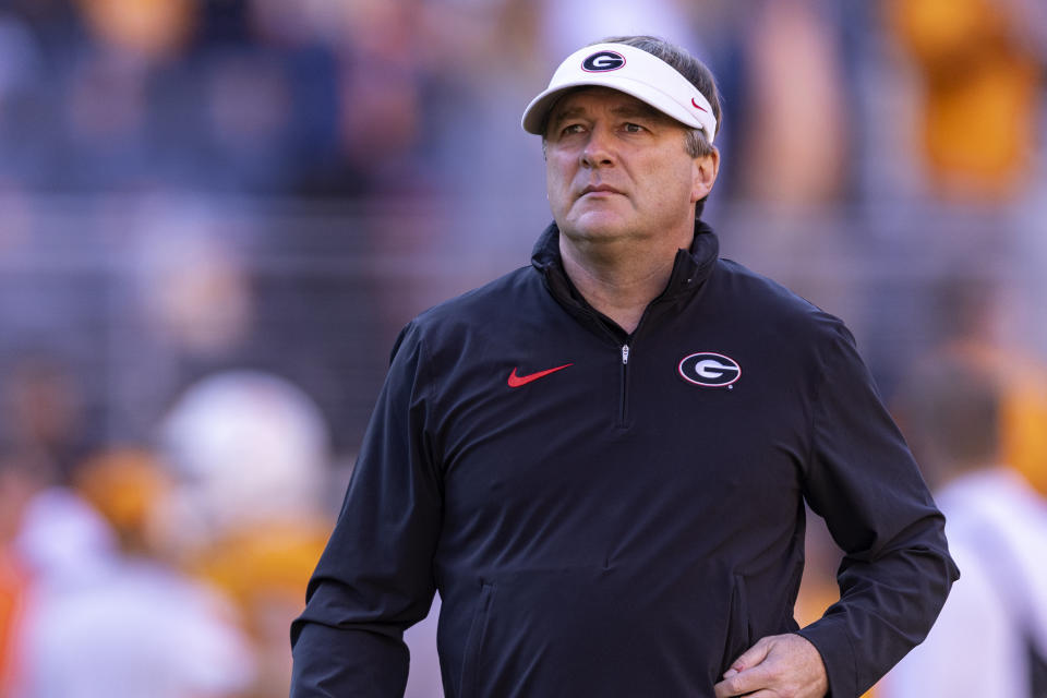 Georgia head coach Kirby Smart watches his players warm up before an NCAA college football game against Tennessee, Saturday, Nov. 18, 2023, in Knoxville, Tenn. (AP Photo/Wade Payne)