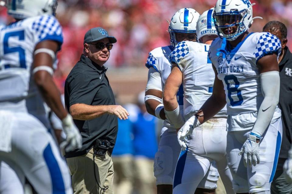 Kentucky Wildcats head coach Mark Stoops talks to his players during a game against Ole Miss at Vaught-Hemingway Stadium in Oxford, Miss., on Saturday, Oct. 1, 2022.