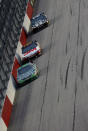 DARLINGTON, SC - MAY 12: Kyle Busch, driver of the #18 Wrigley Toyota, leads Greg Biffle, driver of the #16 3M/OH/ES Ford, and Jimmie Johnson, driver of the #48 Lowe's/Kobalt Tools Chevrolet, during the NASCAR Sprint Cup Series Bojangles' Southern 500 at Darlington Raceway on May 12, 2012 in Darlington, South Carolina. (Photo by Jeff Zelevansky/Getty Images for NASCAR)