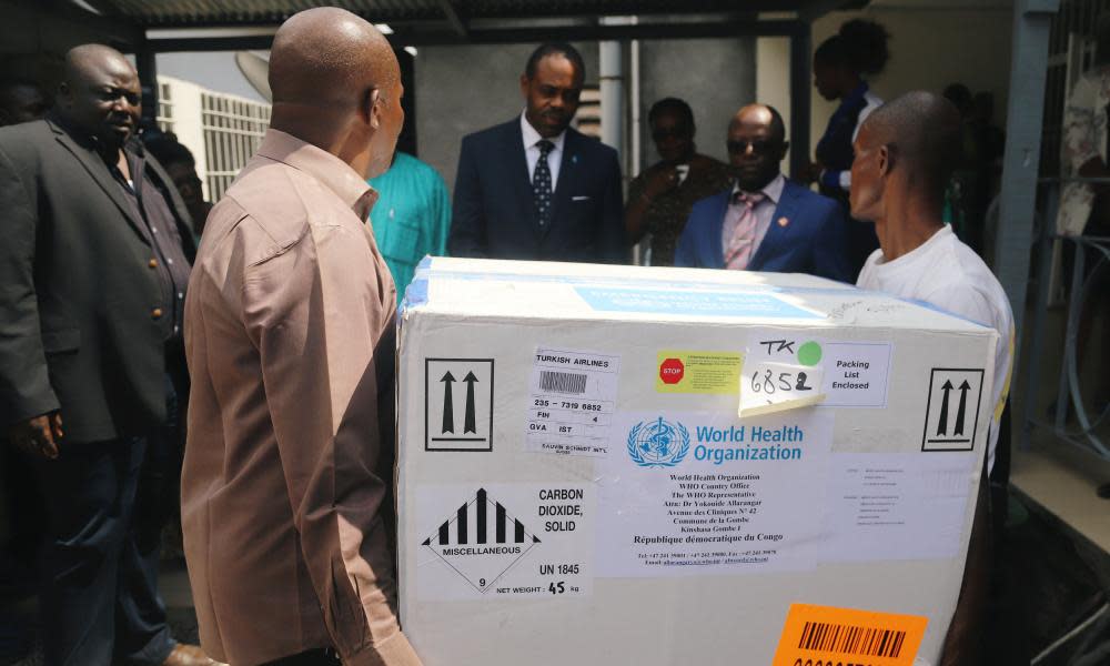 Congolese health ministry officials bearing the first batch of experimental Ebola vaccine are seen in Kinshasa, the Congolese capital