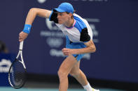 Jannik Sinner, of Italy, follows through on a serve to Daniil Medvedev, of Russia, during a semifinal match at the Miami Open tennis tournament, Friday, March 29, 2024, in Miami Gardens, Fla. (AP Photo/Lynne Sladky)